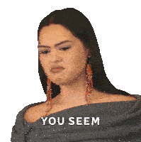 a woman making a funny face with the words you seem behind her