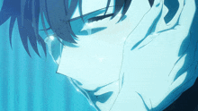a close up of a person 's face with tears running down his face