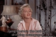 Marilyn Monroe The Seven Year Itch GIF - Marilyn Monroe The Seven Year Itch Champagne GIFs