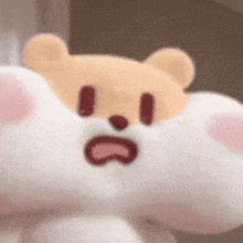 a teddy bear is sitting on top of a white cloud with a surprised face .