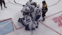 a group of hockey players are huddled together and one of them has the number 41 on his jersey
