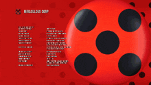 a red ball with black polka dots and a list of credits