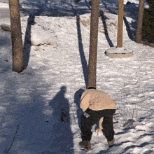 a person standing in the snow wearing a sweatshirt that says ' gap ' on it