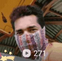 a man with a bandana on his face has the number 271 on the bottom