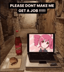 a laptop with a pink anime girl on the screen is sitting on a table next to a bottle of soda