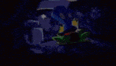 a green frog is laying on the ground in a dark room with a blue background .