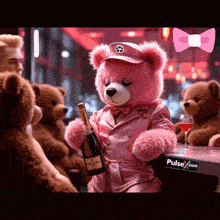 a pink teddy bear holding a bottle of champagne next to a pulse.com sign