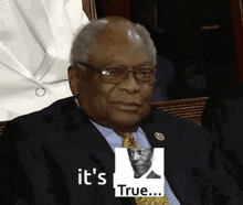 a man in a suit and tie with a picture of a man and the words " it 's true "