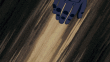 a blue hand with black dots on the fingers is holding something