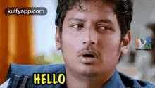 a man is making a funny face and saying `` hello '' with his mouth open .
