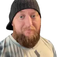 a man with a beard is wearing a beanie and tie dye shirt