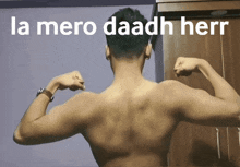 a shirtless man flexes his muscles in front of a sign that says la mero daadh herr