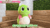 a green dinosaur mascot is standing in front of a brick wall and a wooden bench
