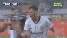 two soccer players are celebrating a goal during a game sponsored by etsson