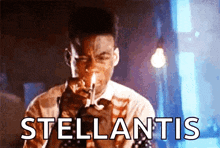 a man is smoking a cigarette and the word stellantis is visible