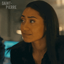 a close up of a woman 's face with saint-pierre written on the bottom right