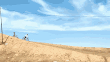 a person is riding a bike down a hill