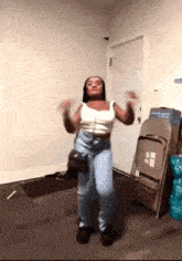 a woman is dancing in front of a folding chair