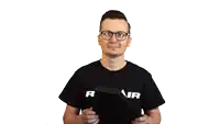 a man wearing a mair shirt gives a thumbs up sign