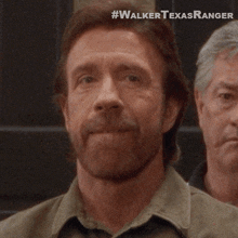 winking cordell walker walker texas ranger flirt smirk