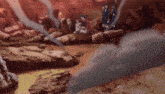a group of people are standing around a pile of rocks