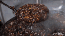a ladle is being used to stir a sauce that is being made in animatica