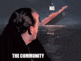 a man is looking at a titanic sinking in the ocean with the words ng the community above him