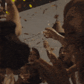 a group of people toasting with wine glasses and confetti with the words endlich selbststandig nie mehr urlaub