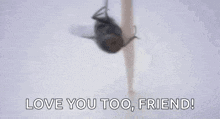 a woman is holding a fly in her hand and says `` love you too , friend '' .