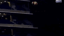 a football is flying through the air in a stadium with 105 and 106 written on the bleachers