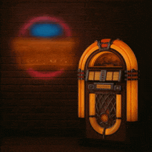 a jukebox is lit up in front of a neon sign that reads welcome to new country legends