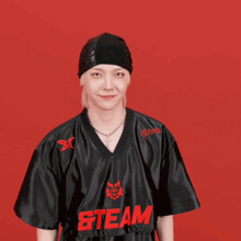 a man is wearing a black shirt that says steam