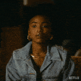 a woman in a denim jacket says you give up on netflix