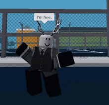 a roblox character says i 'm free in front of a fence