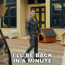 a man walking down the street with the words " i 'll be back in a minute " on the bottom