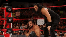 Roman Reigns Seth Rollins GIF - Roman Reigns Seth Rollins Help GIFs