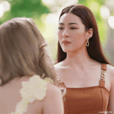 two women are looking at each other and the caption says lingor gifs