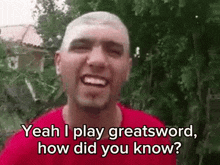 a man in a red shirt is smiling and says yeah i play greatsword how did you know