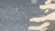 a close up of a person 's hand holding something