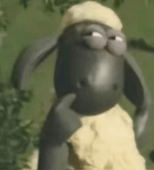a cartoon sheep wearing a hat is standing in a field .
