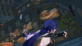 a girl with purple hair is holding a sword in a video game while standing in front of a building .