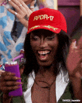 a woman is wearing a red hat that says rpdr-17
