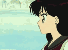 a close up of a girl 's face with the words obsessed with sailormoon below her