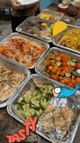 several trays of food with the word tasty on the bottom