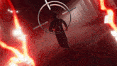 a silhouette of a man in a red room with a target in the middle