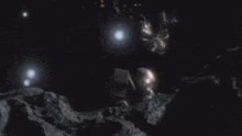 a dark background with a few white clouds and a light coming out of it