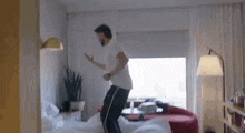 Jeff Wittek Jumping On Bed GIF - Jeff Wittek Jumping On Bed Excited GIFs