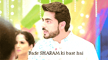 a man with a beard and the words bade sharam ki baat hai behind him
