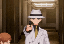a man in a suit is pointing a gun