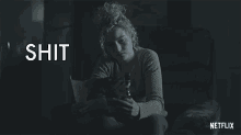 a netflix ad with a woman holding a dog